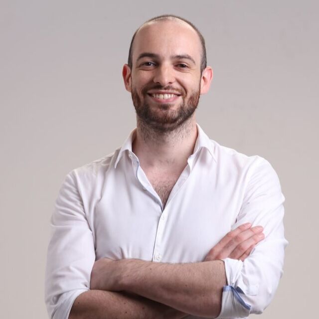 Phil Smithson, smiling, arms folded